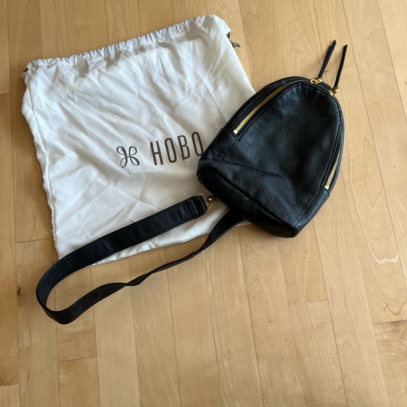 HOBO Black Leather Sling Backpack with Gold Accents - Picture 1 of 4